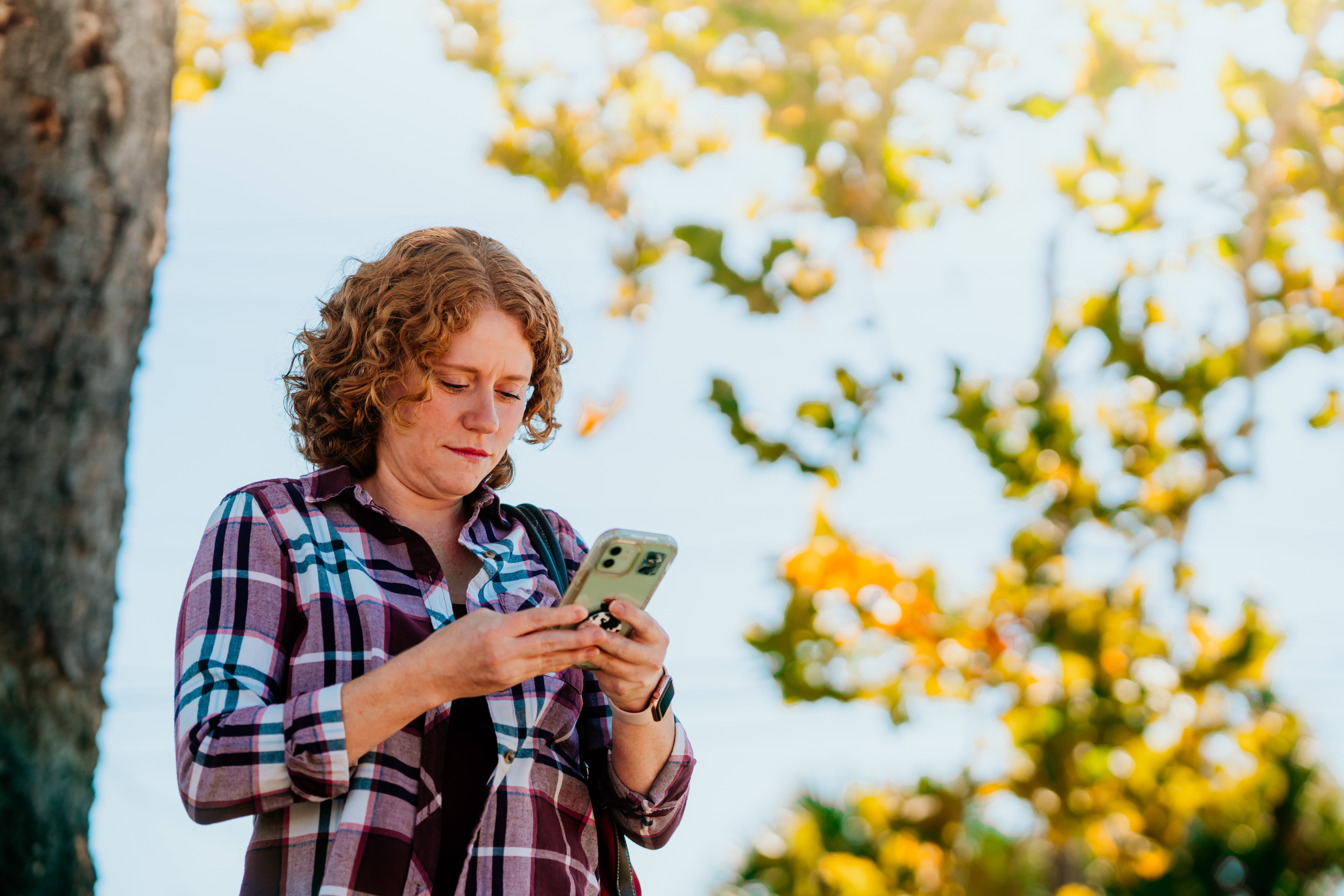 Woman looking at smartphone